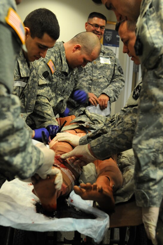 A team of Soldiers from the 399th Combat Support Hospital, 804th Medical Brigade, 3d Medical Command (Deployment Support) apply interventions to a simulated patient during an exercise April 2, 2016 at the Mayo Clinic Multidisciplinary Simulation Center in Rochester, Minnesota. During the exercise, the unit, which is based out of Fort Devens, Massachusetts, practiced the Team Strategies and Tools for Enhanced Performance and Patient Safety, or TeamSTEPPS, model of patient care. TeamSTEPPS is a framework implemented by the Department of Defense to optimize performance of military medical teams and reduce communication errors that can lead to improper patient care.