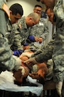 A team of Soldiers from the 399th Combat Support Hospital, 804th Medical Brigade, 3d Medical Command (Deployment Support) apply interventions to a simulated patient during an exercise April 2, 2016 at the Mayo Clinic Multidisciplinary Simulation Center in Rochester, Minnesota. During the exercise, the unit, which is based out of Fort Devens, Massachusetts, practiced the Team Strategies and Tools for Enhanced Performance and Patient Safety, or TeamSTEPPS, model of patient care. TeamSTEPPS is a framework implemented by the Department of Defense to optimize performance of military medical teams and reduce communication errors that can lead to improper patient care.