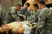 A team of Soldiers from the 399th Combat Support Hospital, 804th Medical Brigade, 3d Medical Command (Deployment Support) apply interventions to a simulated patient during an exercise April 2, 2016 at the Mayo Clinic Multidisciplinary Simulation Center in Rochester, Minnesota. During the exercise, the unit, which is based out of Fort Devens, Massachusetts., practiced the Team Strategies and Tools for Enhanced Performance and Patient Safety, or TeamSTEPPS, model of patient care. TeamSTEPPS is a framework implemented by the Department of Defense to optimize performance of military medical teams and reduce communication errors that can lead to improper patient care.
