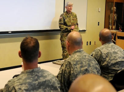 Maj. Gen. Mary E. Link, a Ravenna, Nebraska native and commanding general of the Army Reserve Medical Command, addresses Soldiers from the 399th Combat Support Hospital, 804th Medical Brigade, 3d Medical Command (Deployment Support) April 2, 2016 at the Mayo Clinic Multidisciplinary Simulation Center in Rochester, Minnesota.  Link observed the training the training at the MMSC and commended the 399th CSH Soldiers on their performance. The training was an exercise in implementing the Team Strategies and Tools to Enhance Performance and Patient Safety, or TeamSTEPPS, model of patient care. TeamSTEPPS is a framework that was implemented by the Department of Defense to help optimize medical team performance and reduce communication errors that can lead to improper patient care.