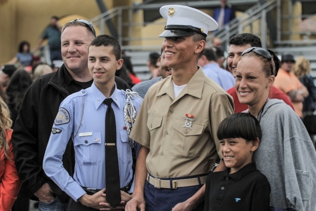Pvt. Raphael Martinez Bobek, a Marine with 2nd Battalion, Hotel Company, Platoon 2173, take photos with famiy and friends after aboard Marine Corps Recruit Depot, San Diego, California, April 8, 2016. Bobek, recruited out of Salt Lake City, graduated from recruit training April 8, 2016.
