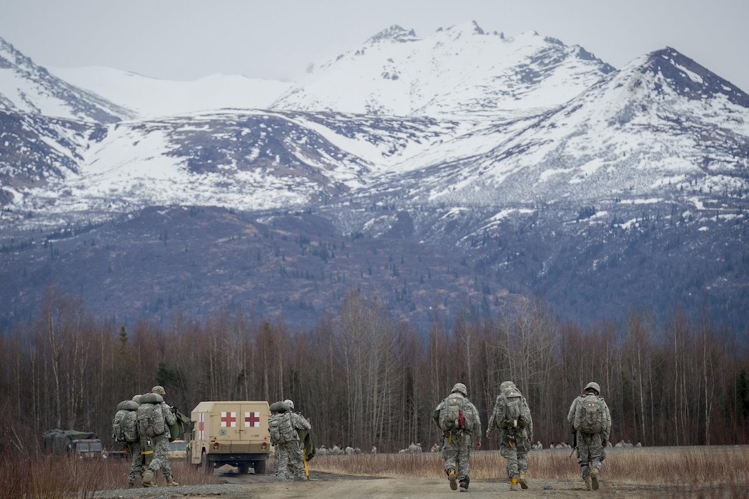 Paratroopers make their way to a rally point after a practice parachute assault onto Malemute drop zone at Joint Base Elmendorf-Richardson, Alaska, April 5, 2016. Air Force photo by Justin Connaher