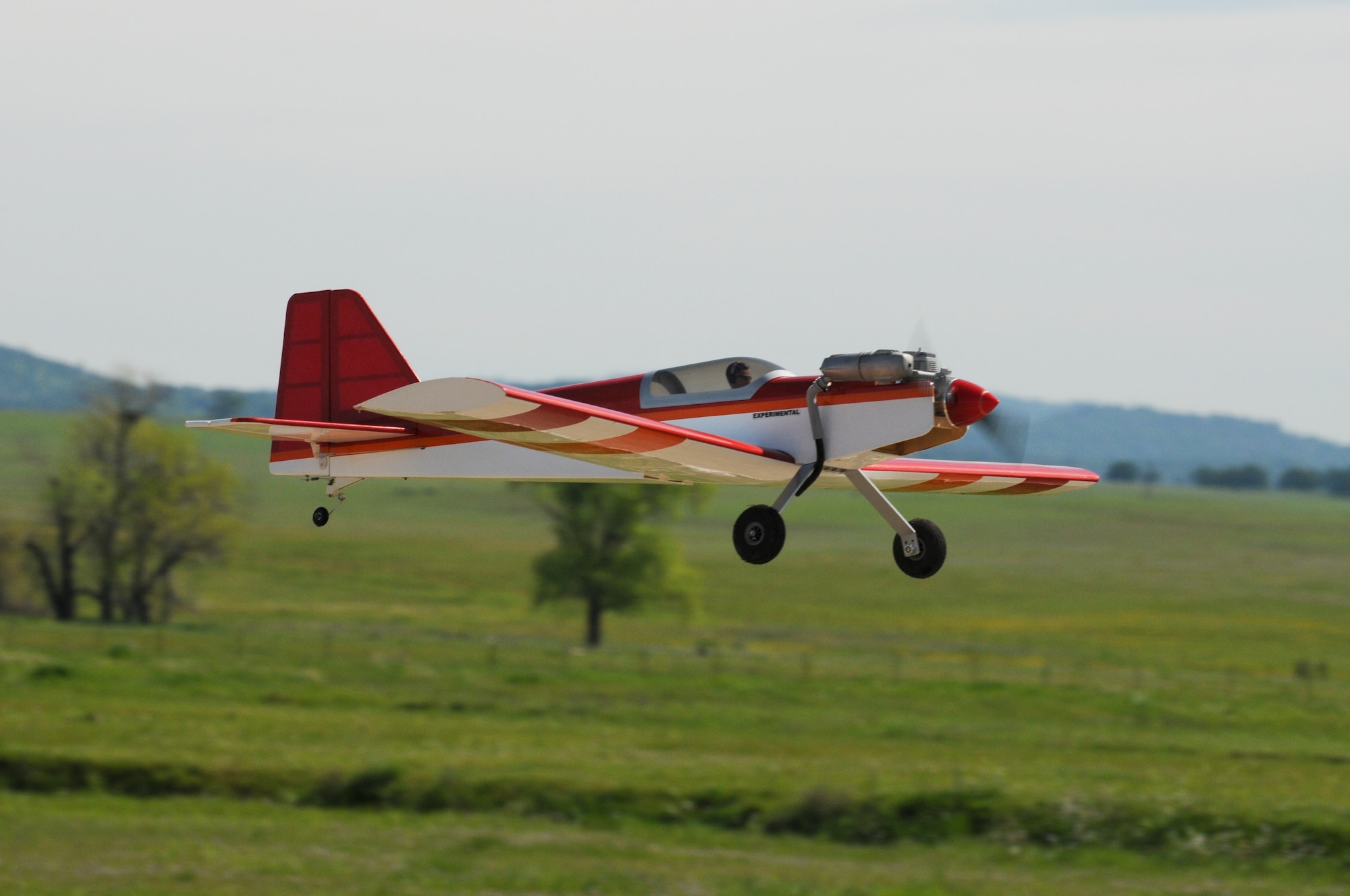 A radio-controlled airplane flies through the air at the Beale Blackbirds Radio Control Club flying field on Beale Air Force Base, California March 25, 2016.The club has events throughout the year where you can meet and learn from experienced members about the sport. (U.S. Air Force photo by Senior Airman Michael J. Hunsaker)

