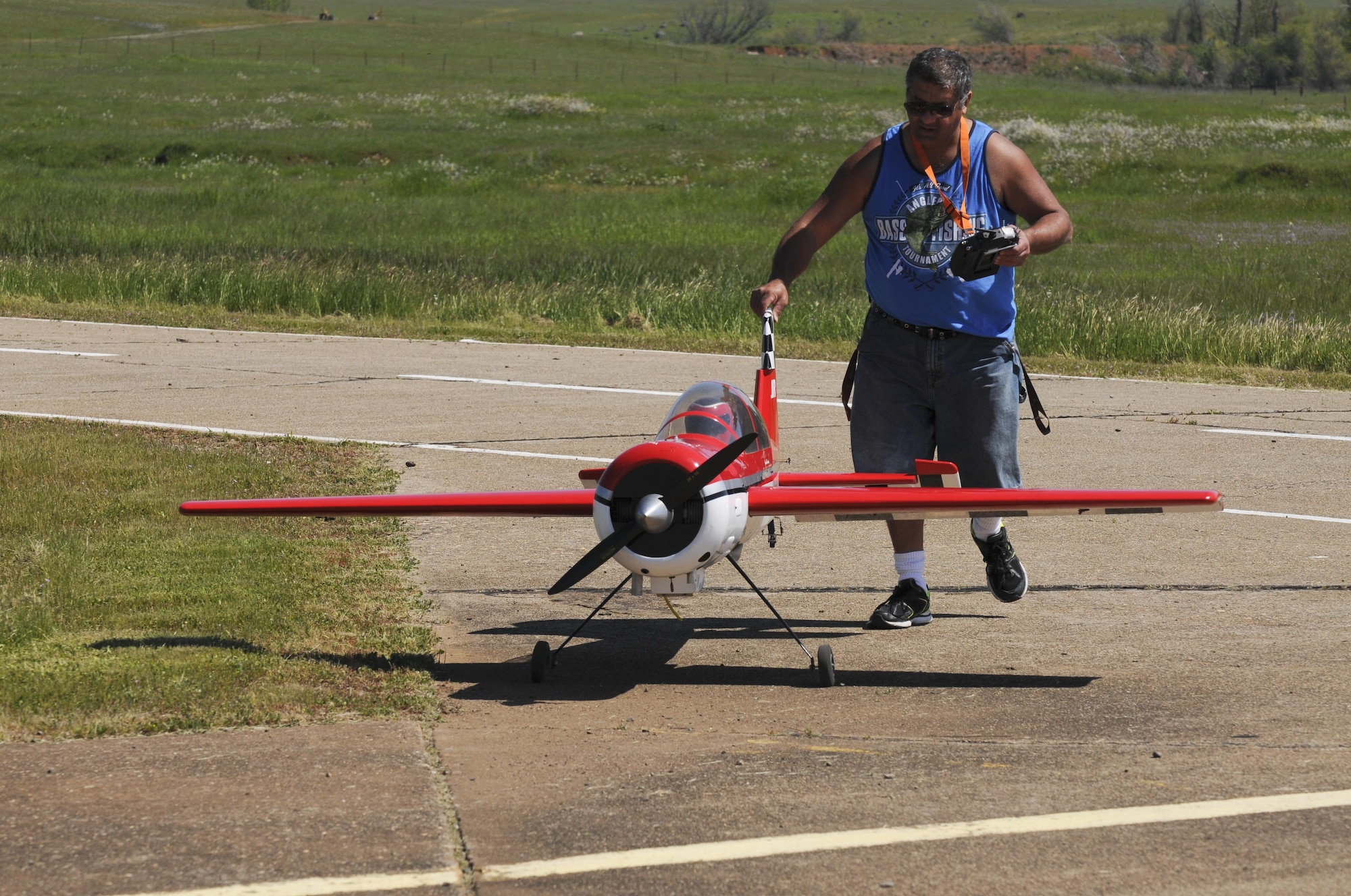 Basil Yousif, Beale Blackbirds Radio Control Club member, walks his remote-controlled airplane flying field on Beale Air Force Base, California March 25, 2016.The club has events throughout the year where you can meet and learn from experienced members about the sport.(U.S. Air Force photo by Senior Airman Michael J. Hunsaker)