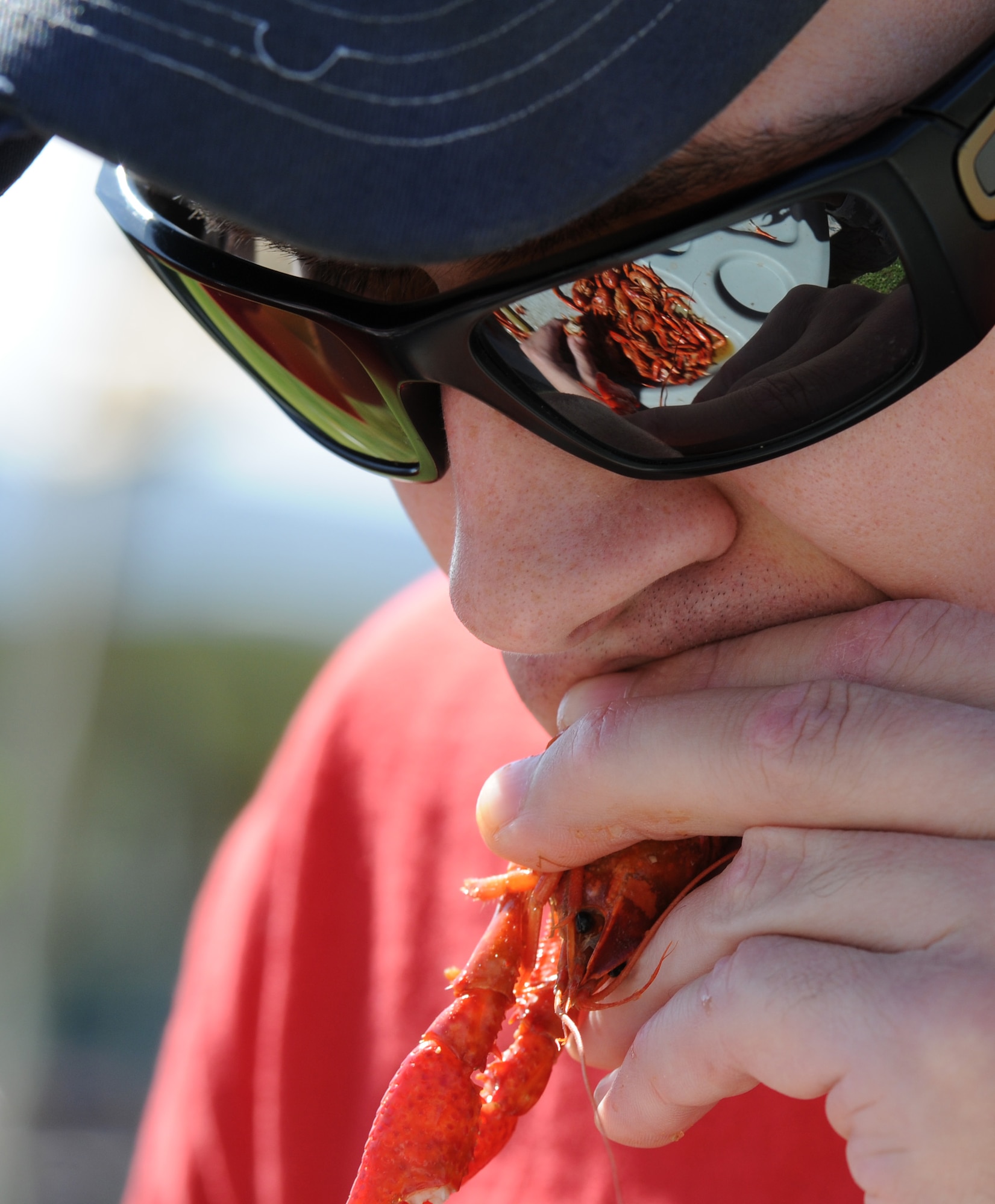 Senior Airman Ryan Fitzgerald, 81st Logistics Readiness Squadron fleet management analysist, eats a crawfish during the 4th Annual Bay Breeze Crawfish Cook-Off at the Bay Breeze Event Center April 8, 2016, Keesler Air Force Base, Miss. The “Bug Smugglers” won the cook-off and decided to gift the trophy and the prize to the second place team, “Kajun Perfection”. “Kajun Perfection” will receive a free entry into the 24th Annual Mississippi Coast Coliseum Crawfish Festival Cook-Off. (U.S. Air Force photo by Kemberly Groue)