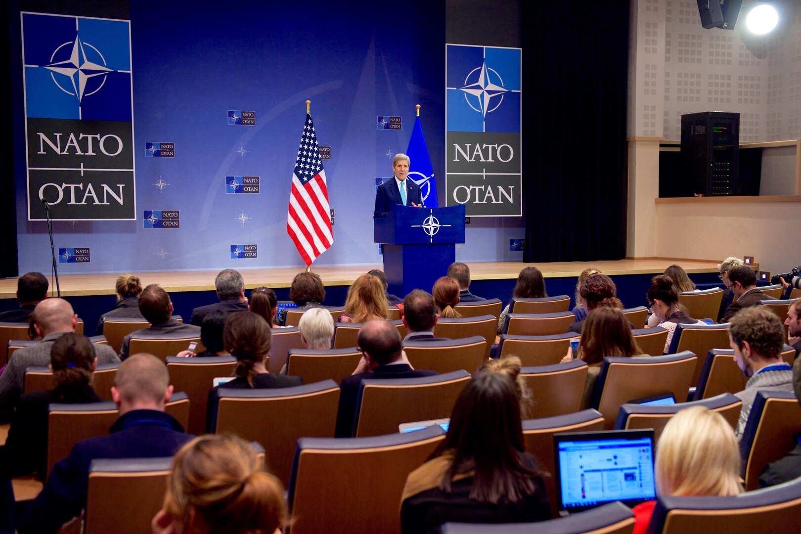 U.S Secretary of State John Kerry addresses reporters at a news conference on December 2, 2015, following a two-day NATO Ministerial meeting at NATO Headquarters in Brussels, Belgium. [State Department photo/ Public Domain]