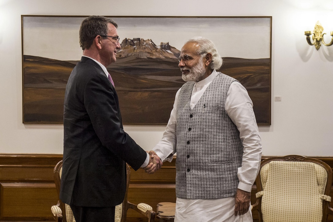 Defense Secretary Ash Carter, left, shakes hands with Indian Prime Minister Narendra Modi as Carter arrives at the prime minster's residence to discuss matters of mutual importance in New Delhi, April 12, 2016. Carter is visiting India to solidify the rebalance to the Asia-Pacific region. DoD photo by Air Force Senior Master Sgt. Adrian Cadiz