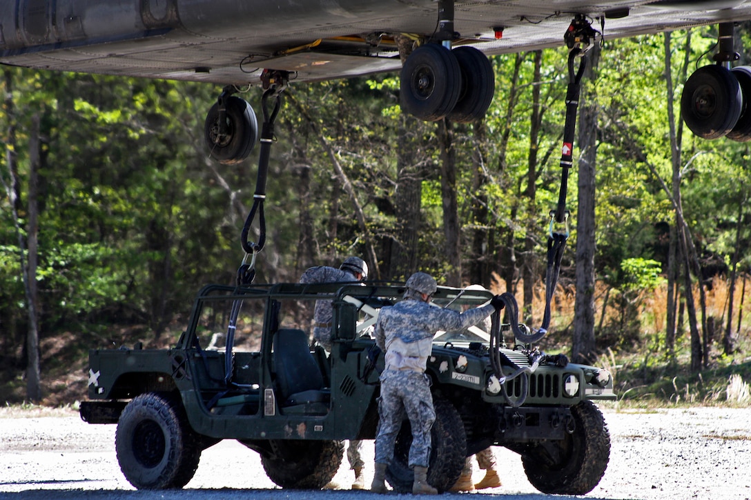 Soldiers move away from a CH-47D Chinook helicopter during slingload training at Clarks Hill Training Site at Plum Branch, South Carolina, April 2, 2016. South Carolina Army National Guard photo by Capt. Brian Hare