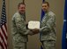 Maj. Matthew Arnold, right, the 336th Training Group chief of standards and evaluations, receives the Airman’s Medal during a ceremony April 8, 2016, at Fairchild Air Force Base, Wash. In 2013, Arnold and Tech. Sgt. Dean Criswell, the 22nd Special Tactics Squadron NCO in charge of rescue operations, were participating in a routine training exercise in Okinawa, Japan, when an HH-60G Pave Hawk went down. They helped save three of the four Airmen on the helicopter. (U.S. Air Force photo/Airman 1st Class Sean Campbell)