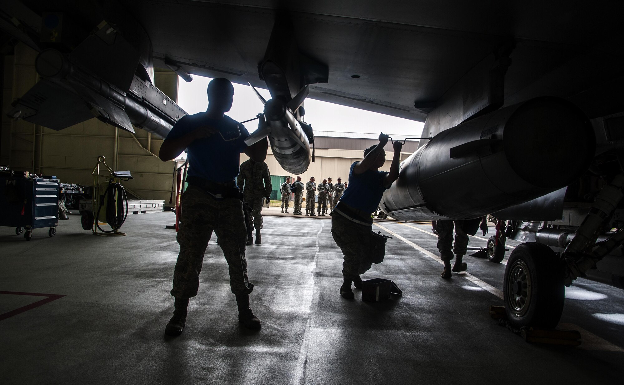 Airmen from the 35th Aircraft Maintenance Unit ensure all bolts are tightened during a first quarter load crew of the quarter competition at Kunsan Air Base, Republic of Korea, April 8, 2016. Three-man teams of Airmen from Kunsan's 80th and 35th Aircraft Maintenance Units battled it out against Airmen from the 8th MXS during 2016’s first quarter Load Crew of the Quarter competition to showcase teamwork, precision and attention to detail among Airmen. (U.S. Air Force photo by Staff Sgt. Nick Wilson/Released)