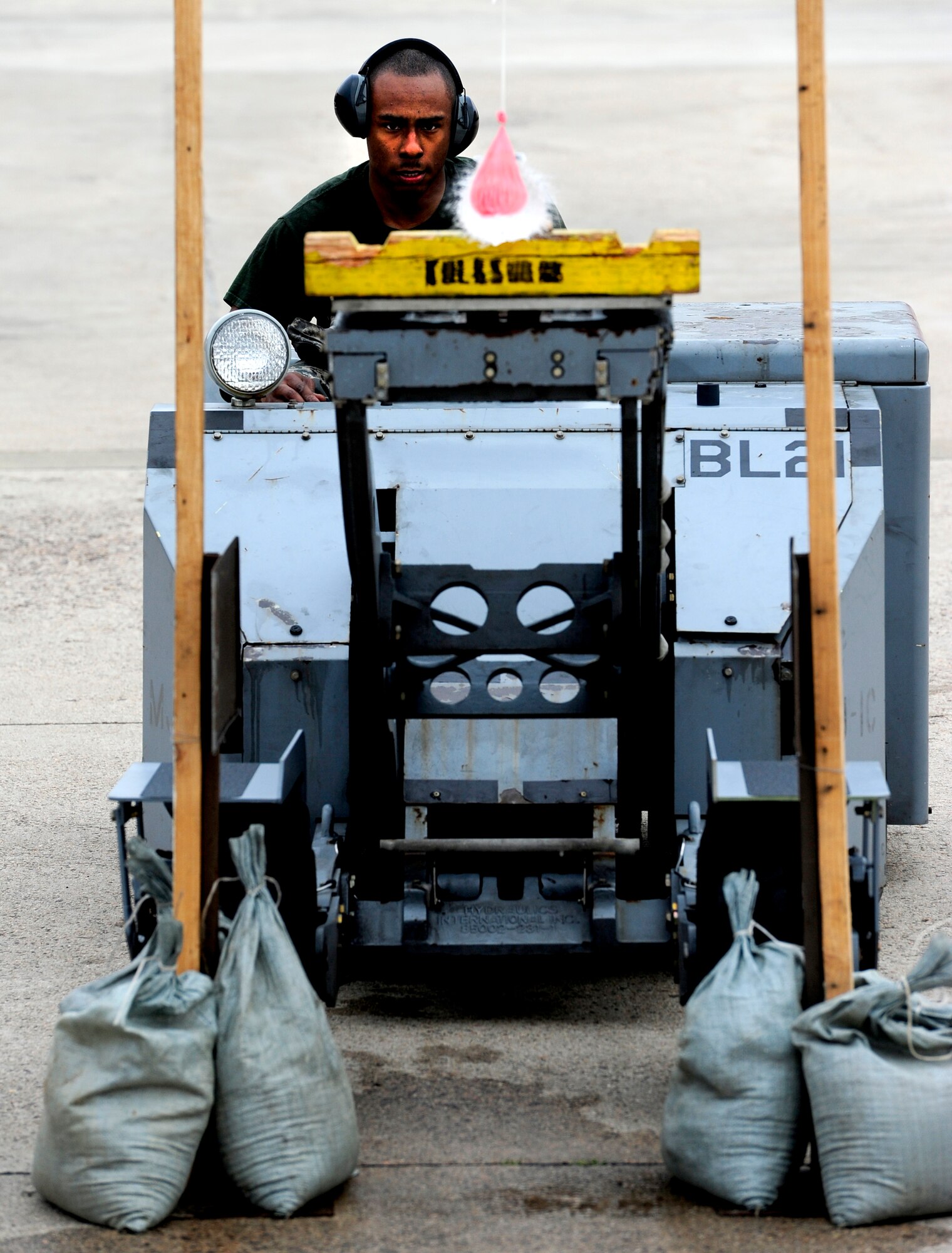 Senior Airman Matthew Dunar, busts a balloon open during the jammer driving portion of the first quarter load crew of the quarter competition at Kunsan Air Base, Republic of Korea, April 8, 2016. During this contest, two jammer drivers from different units battled it out went head-to-head, maneuvering their way around cones towards two balloon station. The first driver to pop the balloon and return to his parking spot won the contest. In an effort to motivate Airmen, help them remain proficient at their jobs and boost morale, these competitions are held quarterly. (U.S. Air Force photo by Staff Sgt. Nick Wilson/Released)