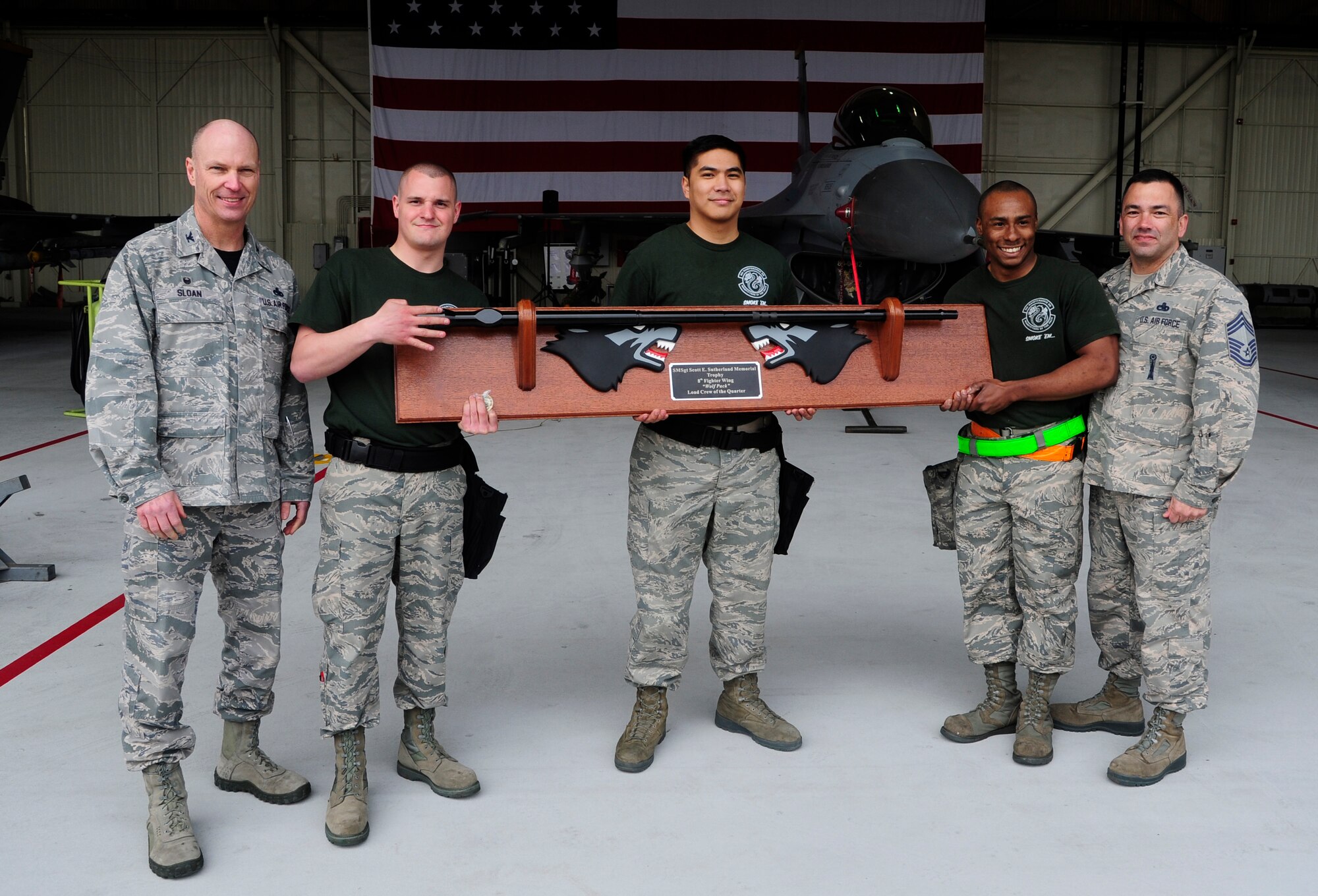 The 8th MXS won the first quarter load crew of the quarter competition for the third consecutive quarter in a row at Kunsan Air Base, Republic of Korea, April 8, 2016. This is the first time in Wolf Pack history this has ever been achieved by an augmented load crew. Three-man teams of Airmen from Kunsan's 80th and 35th Aircraft Maintenance Units battled it out against Airmen from the 8th MXS during 2016’s first-quarter Load Crew of the Quarter competition to showcase teamwork, precision and attention to detail among Airmen. (U.S. Air Force photo by Staff Sgt. Nick Wilson/Released)