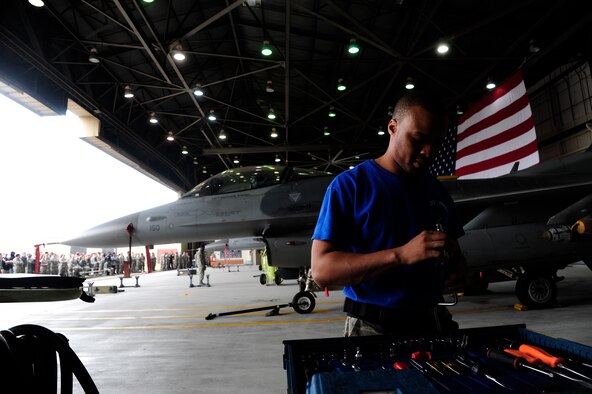 Senior Airman Billy Johnson, 35th Aircraft Maintenance Unit load crew member, selects a tool during a first quarter load crew of the quarter competition at Kunsan Air Base, Republic of Korea, April 8, 2016. The competition provides Airmen an opportunity to showcase their efficiency, skills and levels of experience as maintenance professionals. (U.S. Air Force photo by Staff Sgt. Nick Wilson/Released)