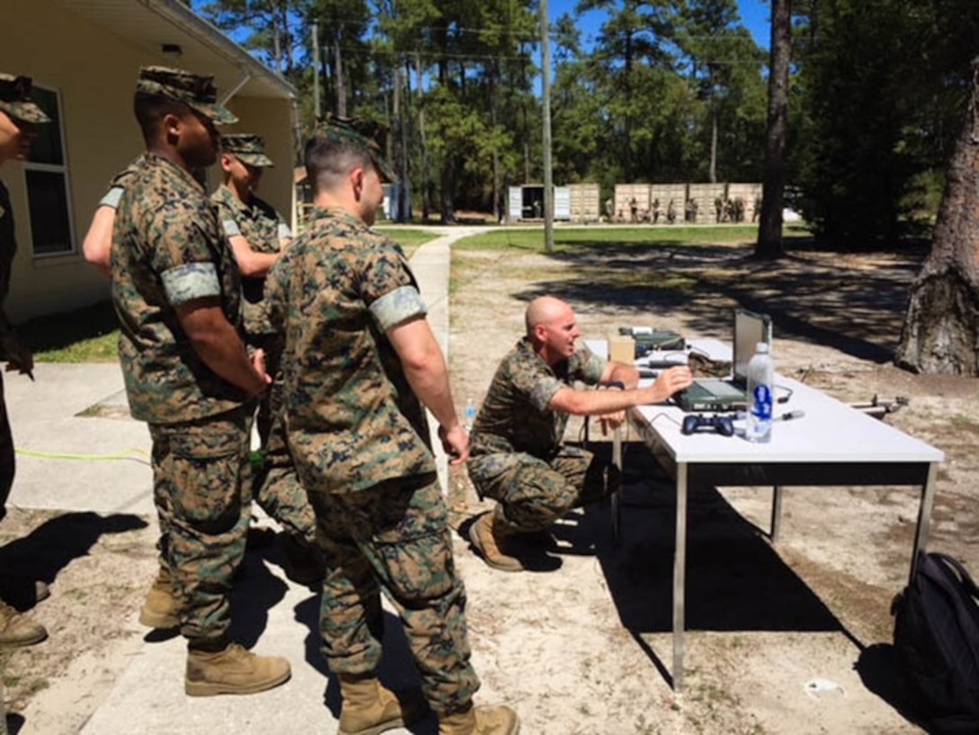 On April 4, 2016 Gunnery Sergeant Douglas Cullins, a Marine instructor with Combat Engineer Instruction Company; teaches Combat Engineer Officer's course 3-16 (CEO 3-16) how to operate the iRobot Pacbot 510 during their Clearance Assets class.   
