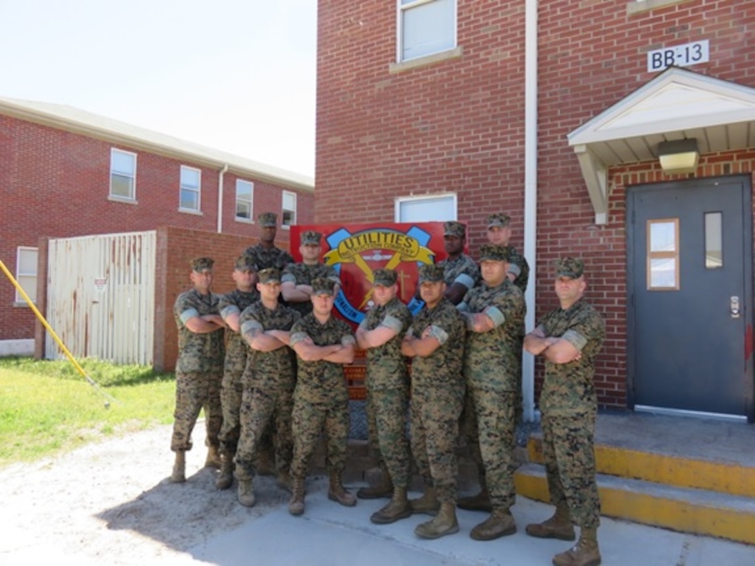 Marines attending Utilities Chief course 2-16 (UC 2-16) take their class photo in front of Utilities Instruction Company on April 6, 2016 at Courthouse Bay. Throughout their time attending the course the Marines have learned about field planning, site characteristics, site selection, site set up, electrical and water planning, and the characteristics and capabilities of all utility equipment.    

 
