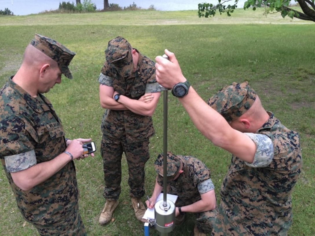 On April 5, 2016 (from left to right) Second Lieutenants Justin Wilkison, Thomas Cofer, Troy Searcy, and Brock Yackey, Marines attending Combat Engineer Officer's course 5-16 (CEO 5-16); practice using the Dynamic Cone Petrometer (DCP).  The DCP is used to test for moisture in the soil which helps determine soil suitability for construction.
