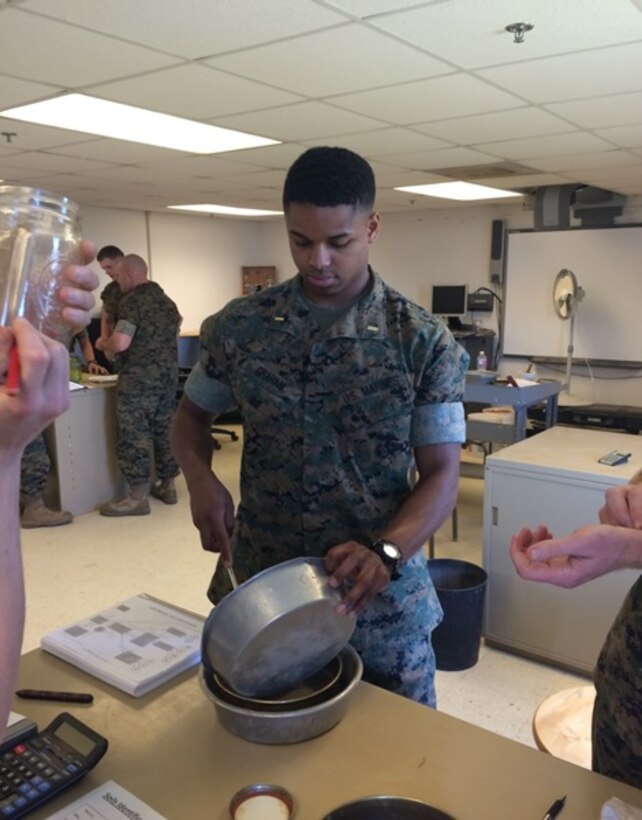 On April 4, 2016 Second Lieutenant Aaron Graham, a Marine attending Combat Engineer Officer's course 5-16 (CEO 5-16); conducts a soil sample by using the Number 200 Sieve to separate sands from fines. Students perform the soil sample to conduct further tests on the fines to determine the type of soil from a given location.

