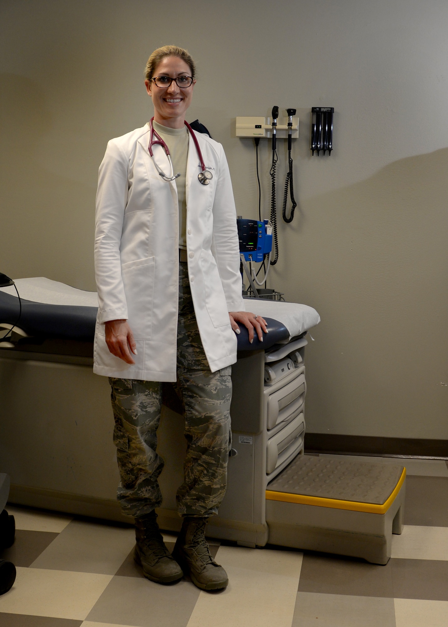 U.S. Air Force Capt. Trisha Benish, 97th Medical Group family medicine physician assistant, poses in the examination room at Altus Air Force Base, Okla., April 12, 2016. Bennish began her Air Force career as an enlisted weather forecaster, commissioned through the medical program and will soon begin a fellowship specializing in emergency medicine. (U.S. Air Force photo by Senior Airman Nathan Clark/Released)
