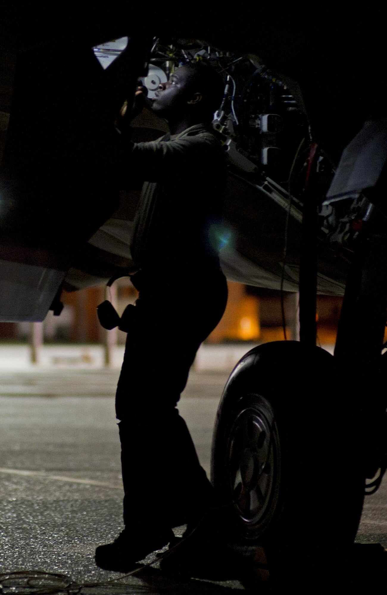 Airman Charles Lampkin, 95th Aircraft Maintenance Unit crew chief, prepares an F-22 Raptor for takeoff at Tyndall Air Force Base, Fla., April 11, 2016. Rapid Raptor deployments increase the operational capability available to ensure and enhance international security and stability. (U.S. Air Force photo by Senior Airman Alex Fox Echols III/Released)