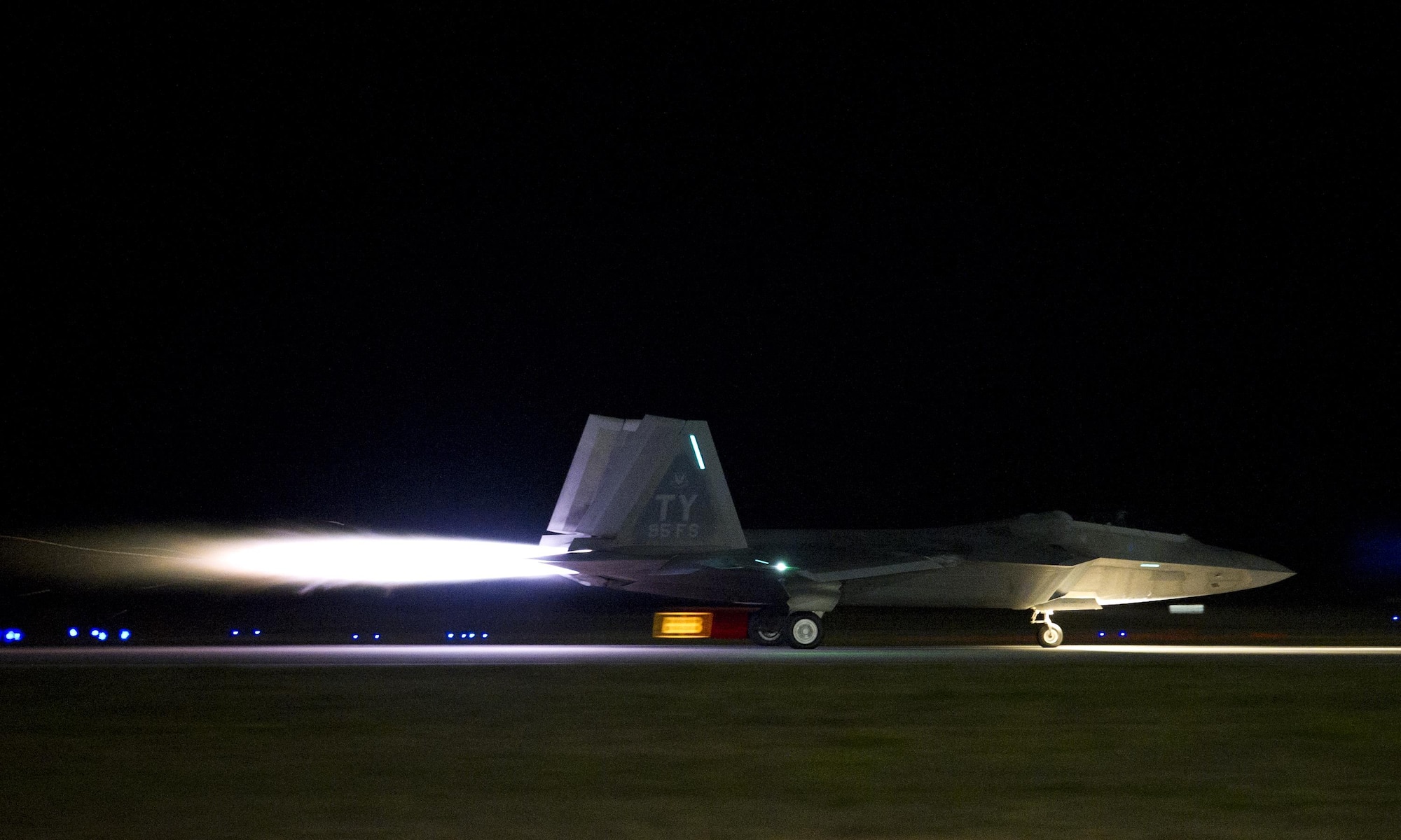 A 95th Fighter Squadron F-22 Raptor takes off with afterburners during Rapid Raptor, April 11, 2016, at Tyndall Air Force Base, Fla. Rapid Raptor tests the 95th’s ability to quickly respond to a tasking and establish dynamic combat air power in support of U.S. commitment to European security and stability. Raptors, Airmen and associated equipment deployed to Royal Air Force Lakenheath, England, to conduct air training with other Europe-based aircraft. (U.S. Air Force photo by Senior Airman Alex Fox Echols III/Released)