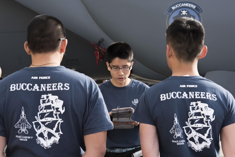 ME2-1 Ten Wee Chong, 428th Aircraft Maintenance Unit flightline crew member, briefs his team before a load crew competition April 9, 2016, at Mountain Home Air Force Base, Idaho. The Republic of Singapore Air Force first joined U.S. airmen in their quarterly load competitions in 2009. (U.S. Air Force photo by Airman Alaysia Berry/RELEASED)