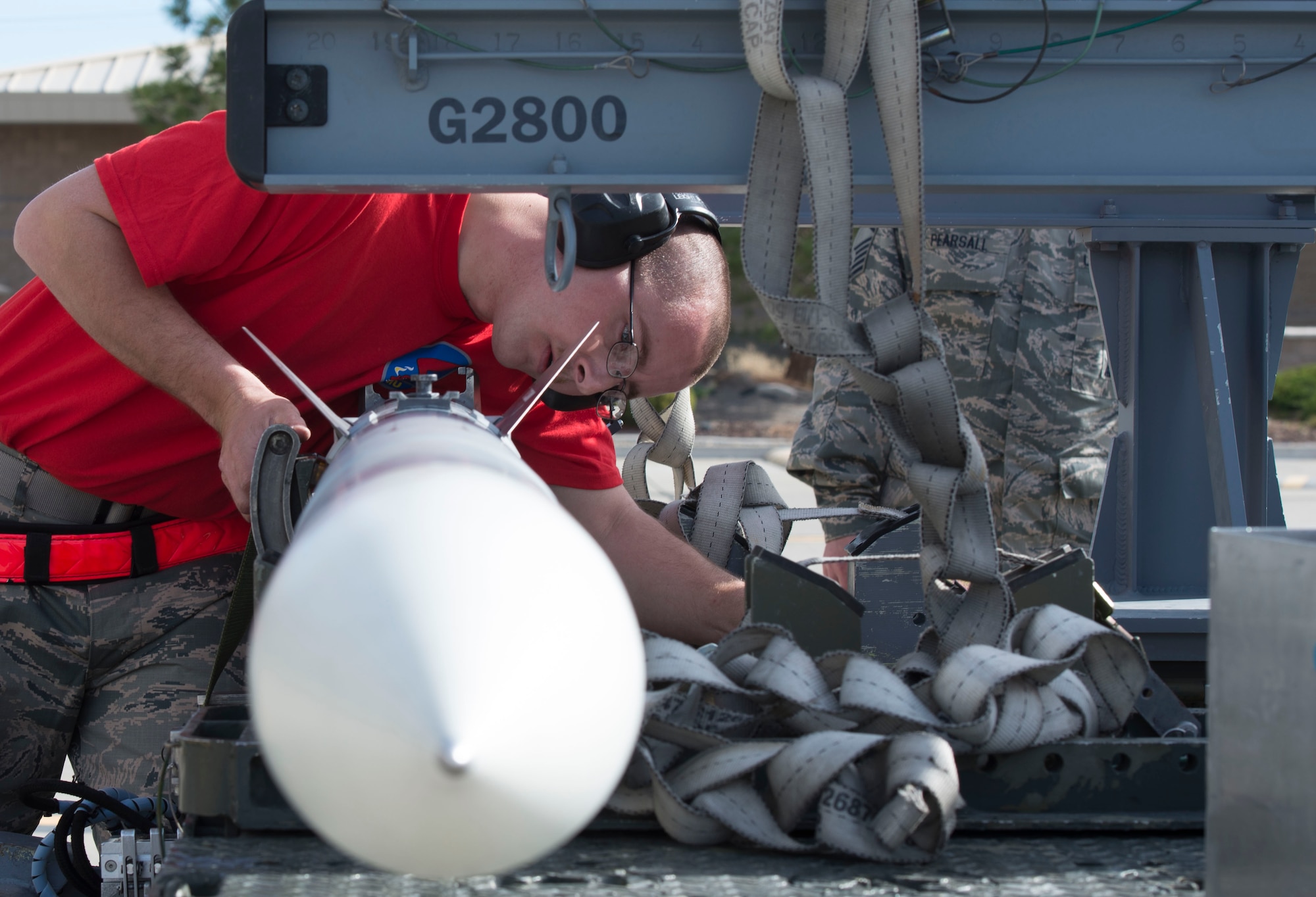 Staff Sgt. Grant Wrinkle, 389th Aircraft Maintenance Unit weapons load crew chief, inspects a bomb during a load competition, April 9, 2016, at Mountain Home Air Force Base, Idaho. The 389th AMU completed the competition in 25 minutes and 13 seconds. (U.S. Air Force photo by Airman 1st Class Chester Mientkiewicz/Released)