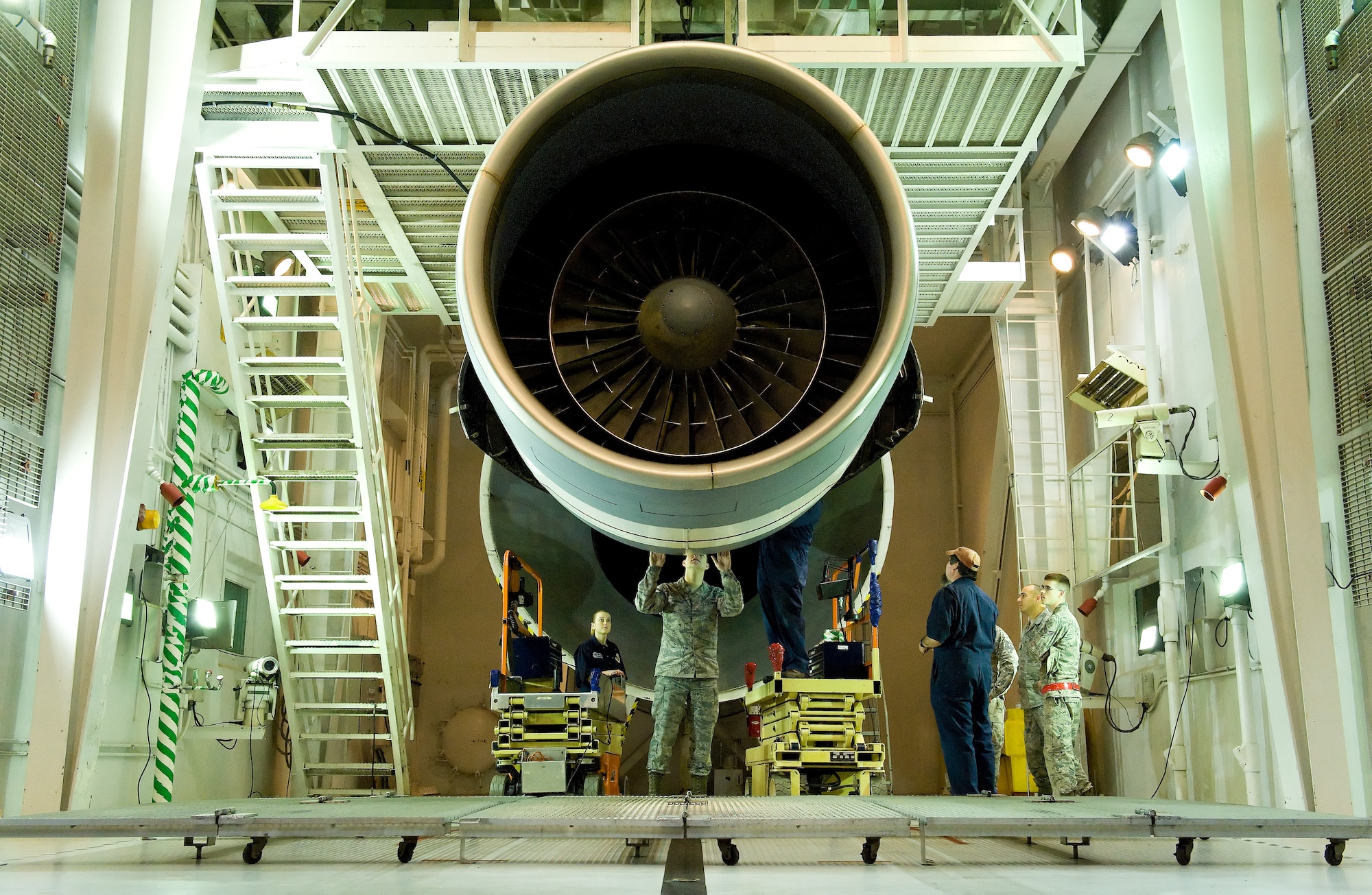 Personnel assigned to the 436th Maintenance Squadron Jet Engine Test Cell perform maintenance on a General Electric TF39 high bypass turbofan engine March 17, 2016, on Dover Air Force Base, Del. This engine, serial number 441052, was the 5,601st and last TF39 to be tested in the test cell. (U.S. Air Force photo/Roland Balik)