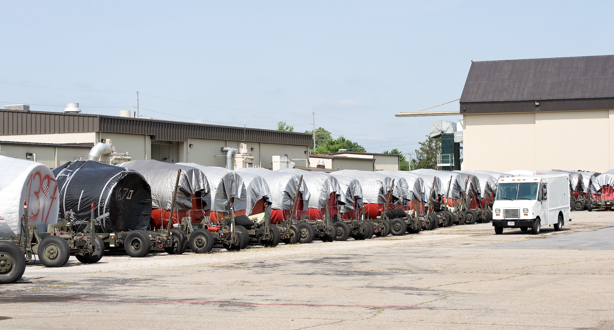 Numerous General Electric TF39 engines loaded on engine trailers sit on the reclamation line July 21, 2014, on Dover Air Force Base, Del. The TF39 engine is used on legacy C-5A/B Galaxy aircraft. (U.S. Air Force photo/Roland Balik)