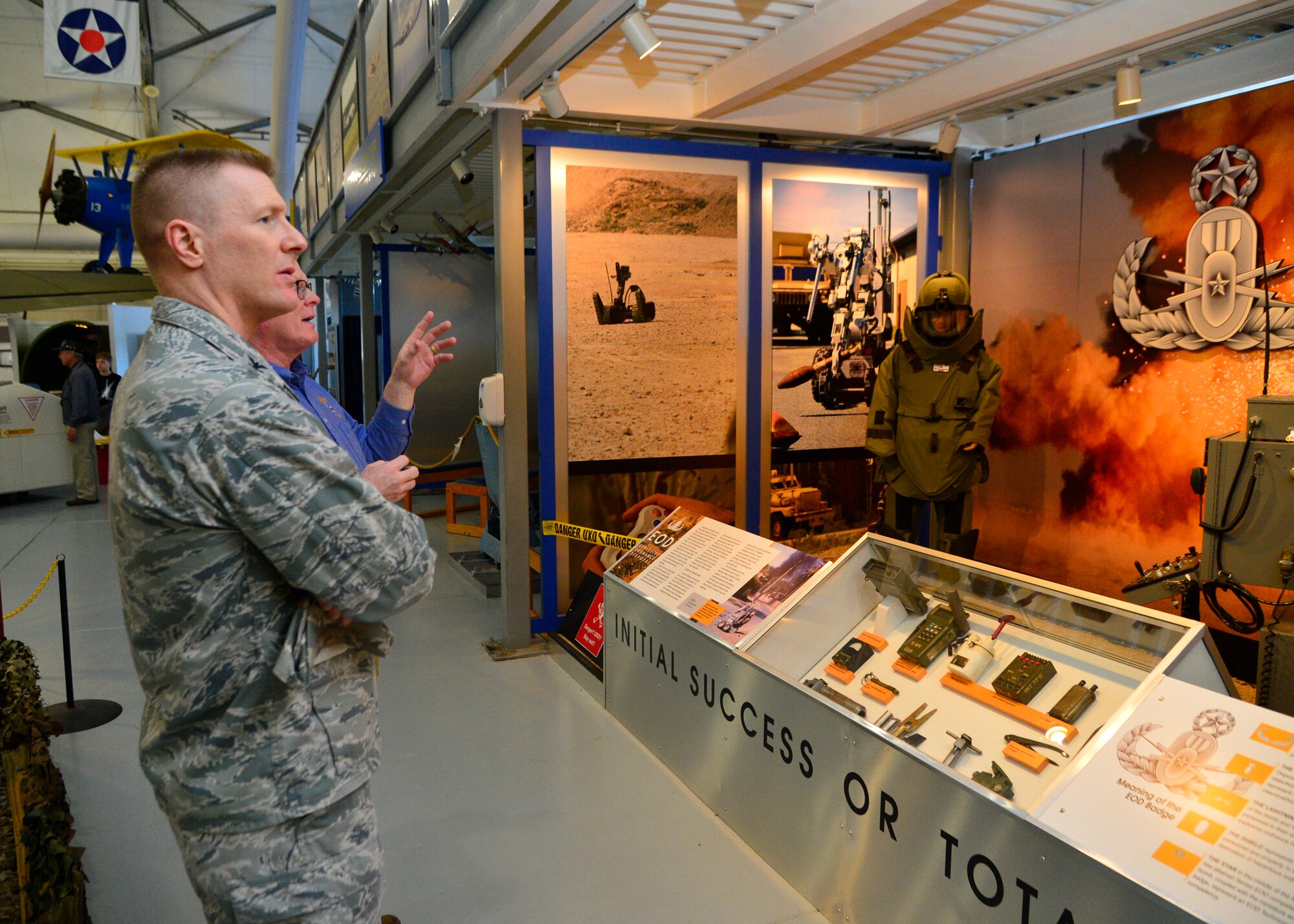 Col. Michael Grismer, 436th Airlift Wing commander, looks at the newly completed Explosive Ordinance Disposal exhibit March 30, 2016, at the Air Mobility Command Museum at Dover Air Force Base, Del. The EOD exhibit is one of many new additions for visitors of the museum. (U.S. Air Force photo/Senior Airman William Johnson)