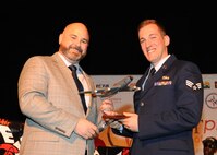 Senior Airman Zachariah Daehn, 141st Logistics Readiness Squadron fuels journeyman, receives the Junior Enlisted of the Year Award from the West Plains Chamber of Commerce at the Best of the West Awards Gala April 8 in Airway Heights, Wash. The event recognized outstanding contributions to the local community. (U.S. Air Force photo/Senior Airman Sam Fogleman)