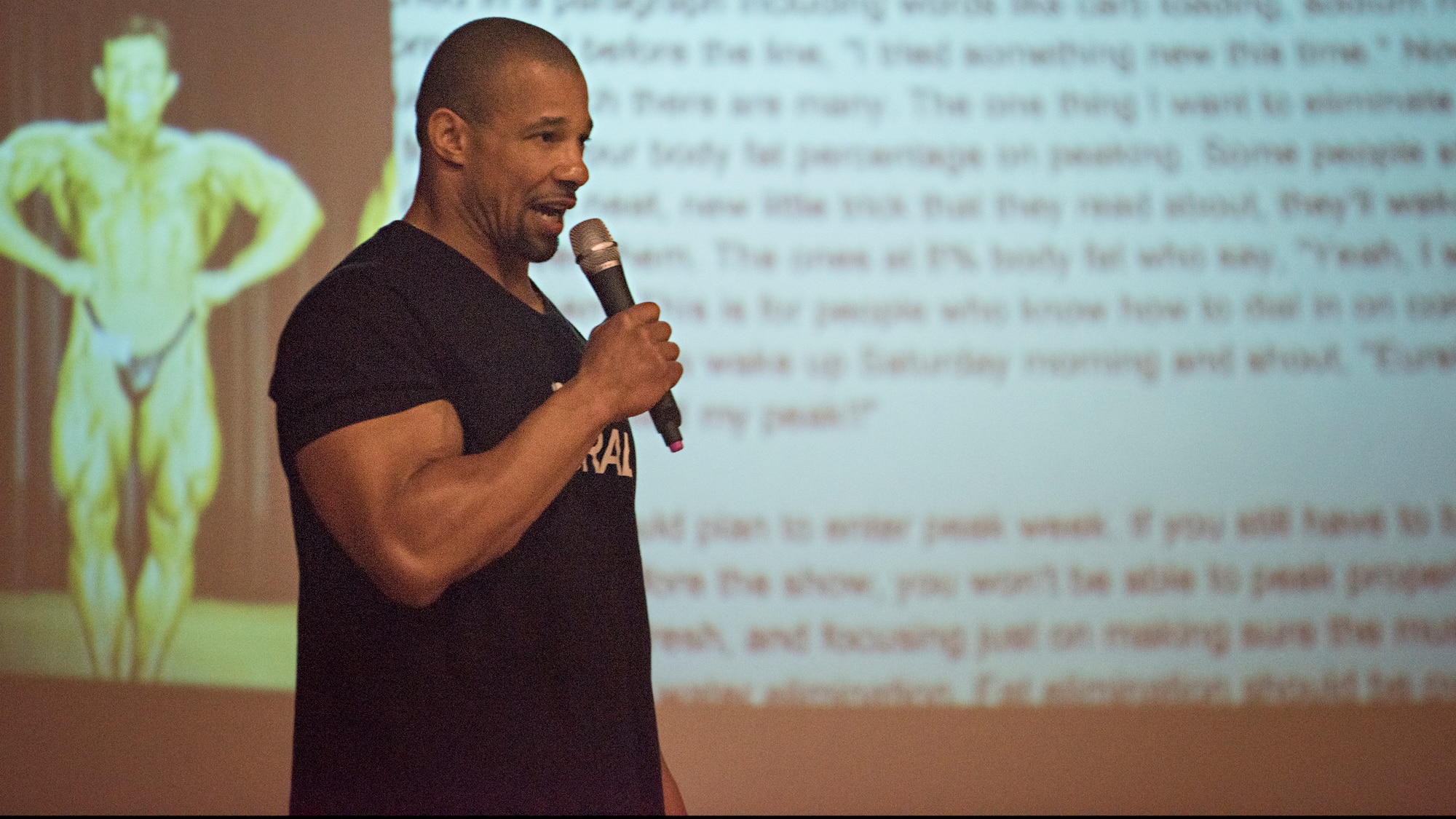 Philip Ricardo, Jr., Mr. Olympia Natural award winner, speaks to a group of service members about his lifestyle April 2, 2016 at Joint Base McGuire-Dix-Lakehurst, N.J. During the seminar, he discussed fitness, healthy eating and overcoming challenges. (U.S. Air Force photo by Staff Sgt. Katherine Tereyama)