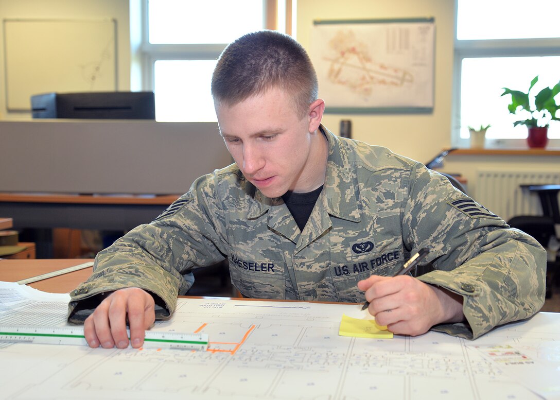 U.S. Air Force Staff Sgt. Scott Haeseler, 100th Civil Engineer Squadron structures journeyman, runs through pre-check information to confirm measurements and square footage of facilities March 4, 2016, on RAF Mildenhall, England. Haeseler was awarded the Square D Spotlight for displaying the core value of Excellence in All We Do. (U.S. Air Force photo by Karen Abeyasekere/Released)