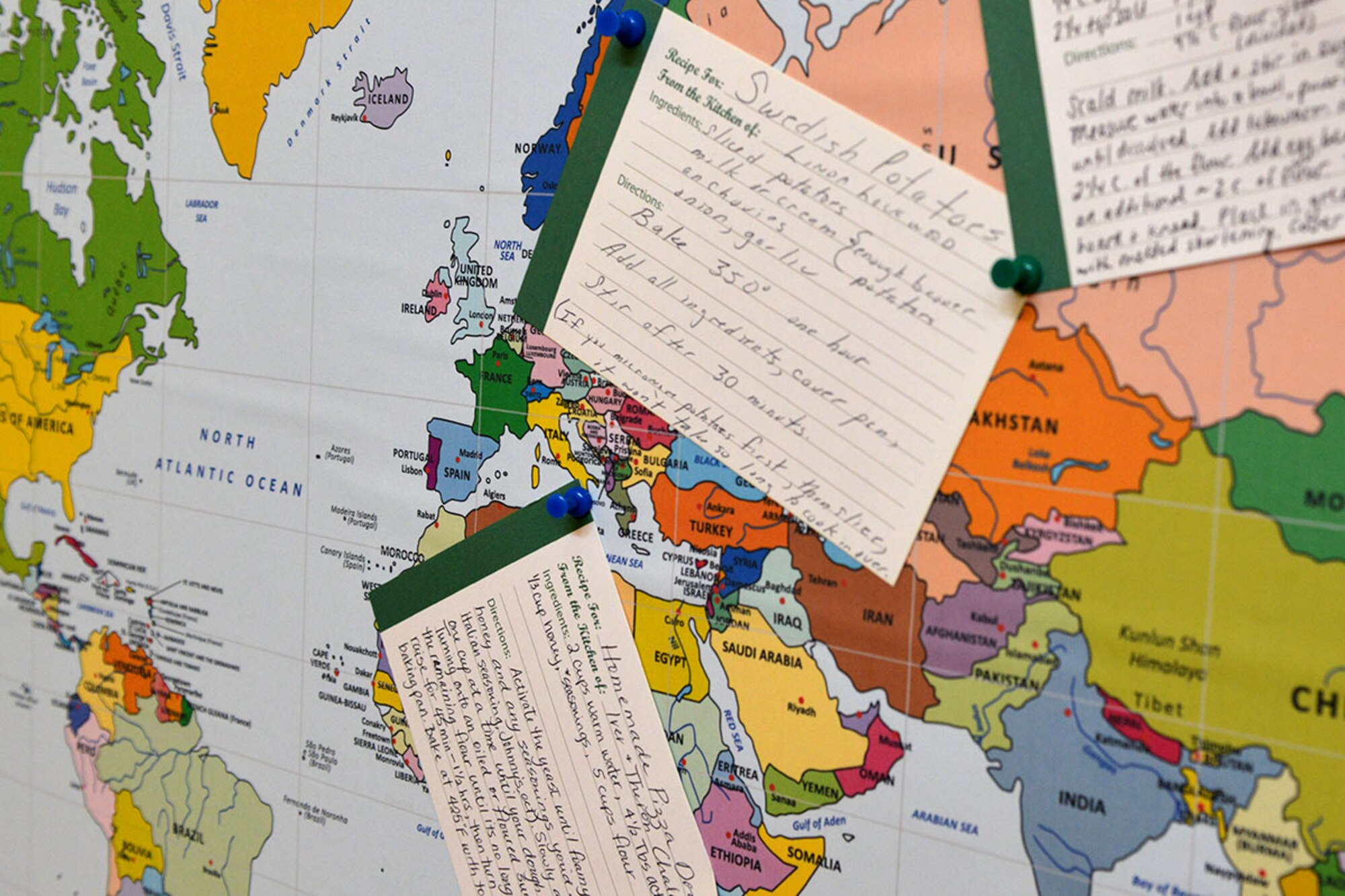 Recipes cover a world map near the entrance of the Denali Child Development Center on Joint Base Elmendorf-Richardson, Alaska, April 6, 2016. The map is on display as part of a Recipes from Around the World campaign, where children share their favorite food recipes from around the world. (U.S. Air Force photo by Airman 1st Class Javier Alvarez)