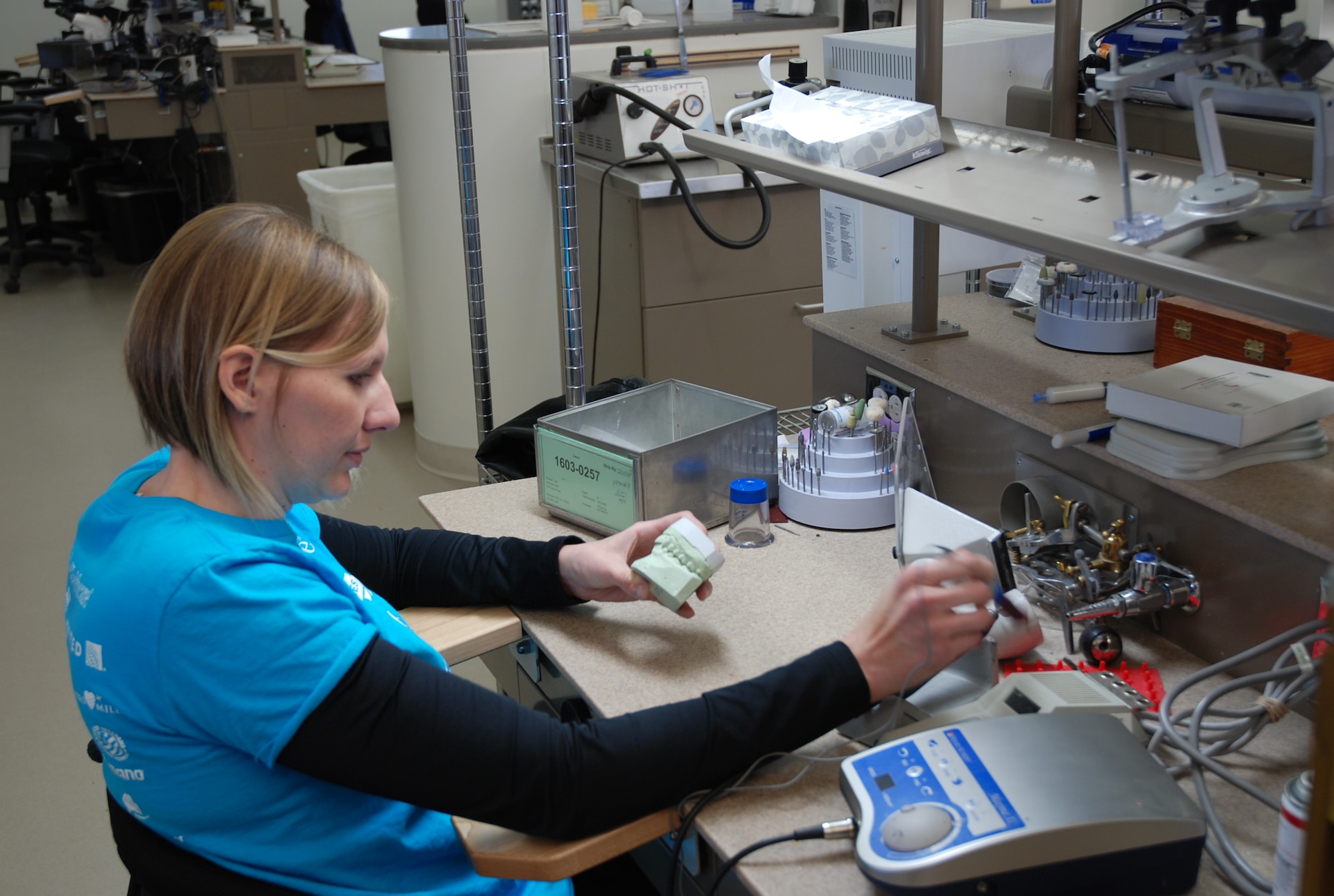 PETERSON AIR FORCE BASE, Colo. – Staff Sgt. Velette Webb was paralyzed from the waist down in a mountain bike accident August, 2015. She continues to fulfill her duties with the 21st Dental Squadron in the area dental lab until her medical orders are completed. (U.S. Air Force photo by Dave Smith)
