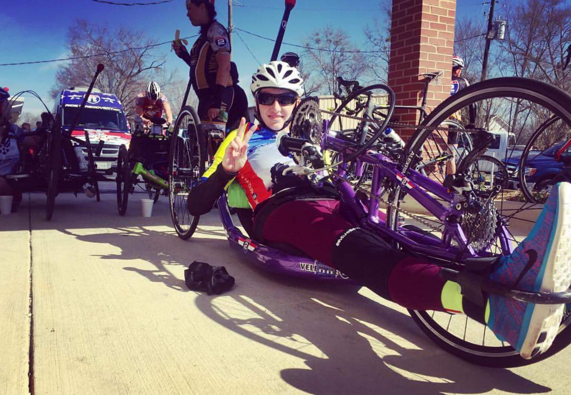 Staff Sgt. Velette Webb, 21st Dental Squadron, flashes a “V” for Velette as she prepares for a day of riding in the Road 2 Recovery Gulf Coast Challenge in March, 2016. Webb continues to ride in the organization’s events after becoming paralyzed in an August, 2015 mountain biking accident. (Courtesy photo)