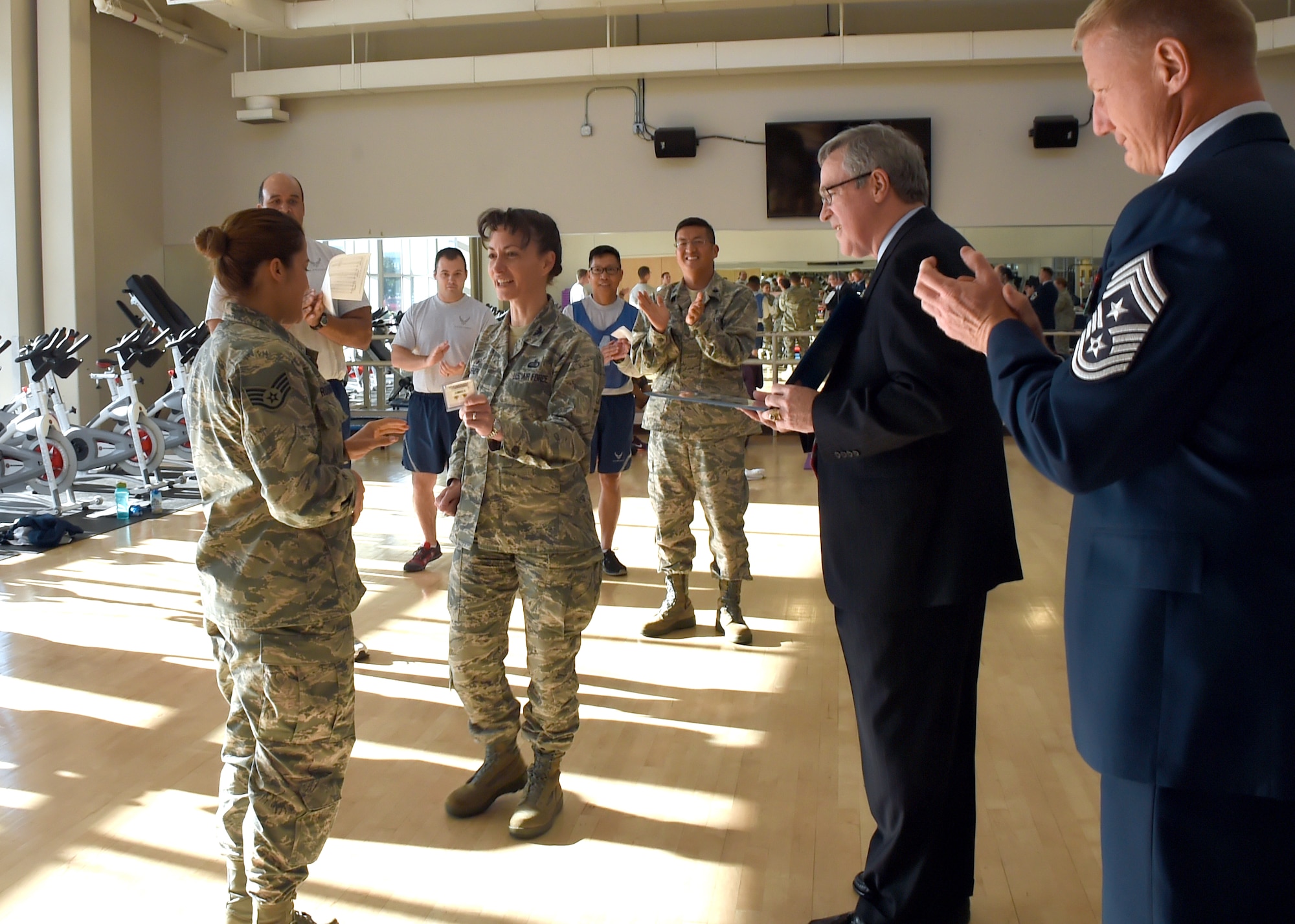 Col. Donna Turner, 61st Air Base Group commander, presents a pair of gold bars signifying the rank of a 2nd Lieutenant to Staff Sgt. Katelin Robinson upon her selection for Officer Training School through the Senior Leader Enlisted Commissioning Program from Gen. John Hyten, commander of Air Force Space Command, as Thomas Fitzgerald, Space and Missile Systems Center acting executive director and Chief Master Sgt. Craig Hall, SMC command chief, look on. Robinson is the 61st Medical Squadron's noncommissioned officer in charge of Dental Logistics at the Los Angeles Air Force Base medical clinic in El Segundo, Calif. (U.S. Air Force photo/Sarah Corrice)   