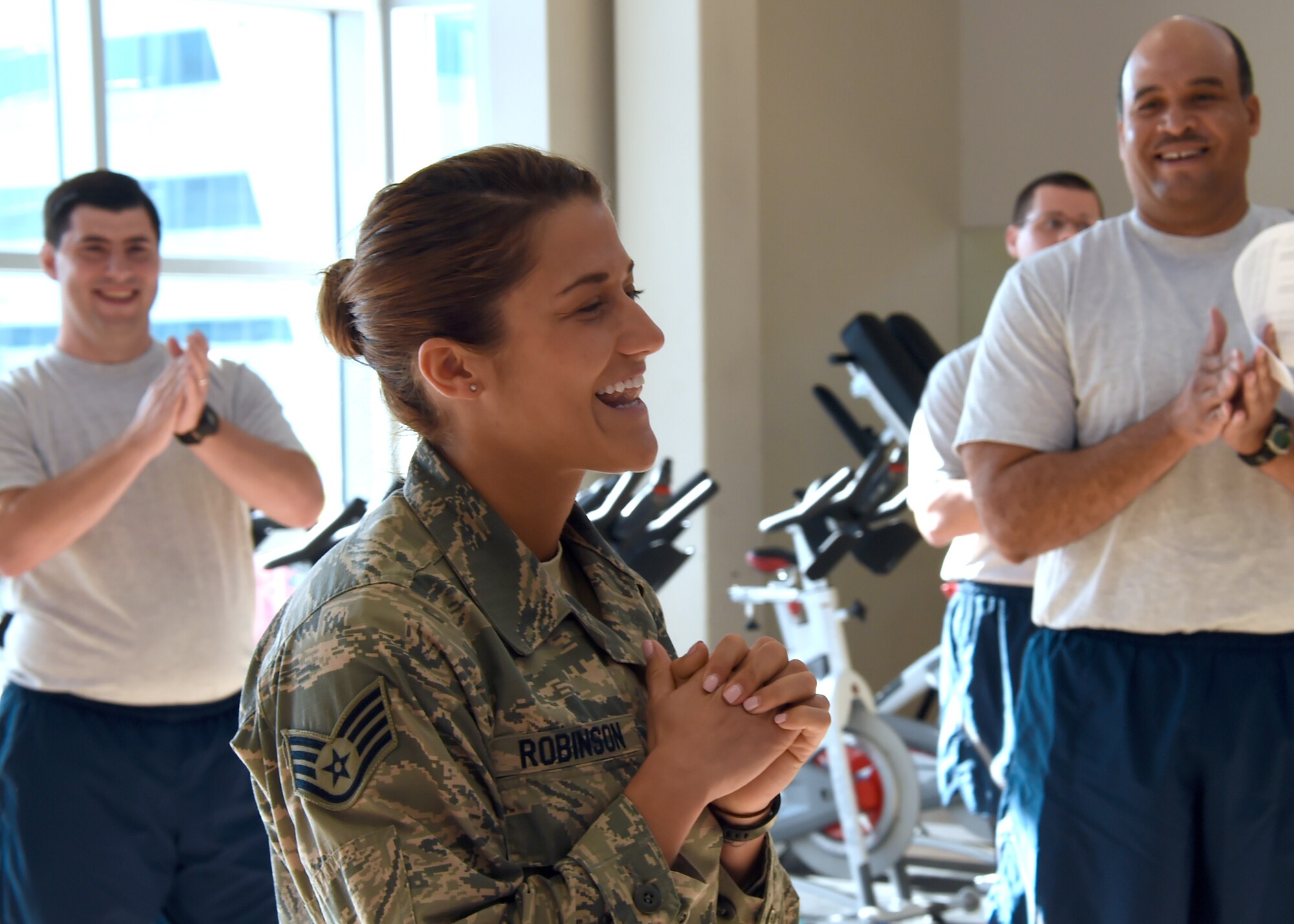 Relief turns to pure joy after Staff Sgt. Katelin Robinson is notified of her selection for Officer Training School through the Senior Leader Enlisted Commissioning Program.  Robinson is the 61st Medical Squadron's noncommissioned officer in charge of Dental Logistics at the Los Angeles Air Force Base medical clinic in El Segundo, Calif. (U.S. Air Force photo/Sarah Corrice)