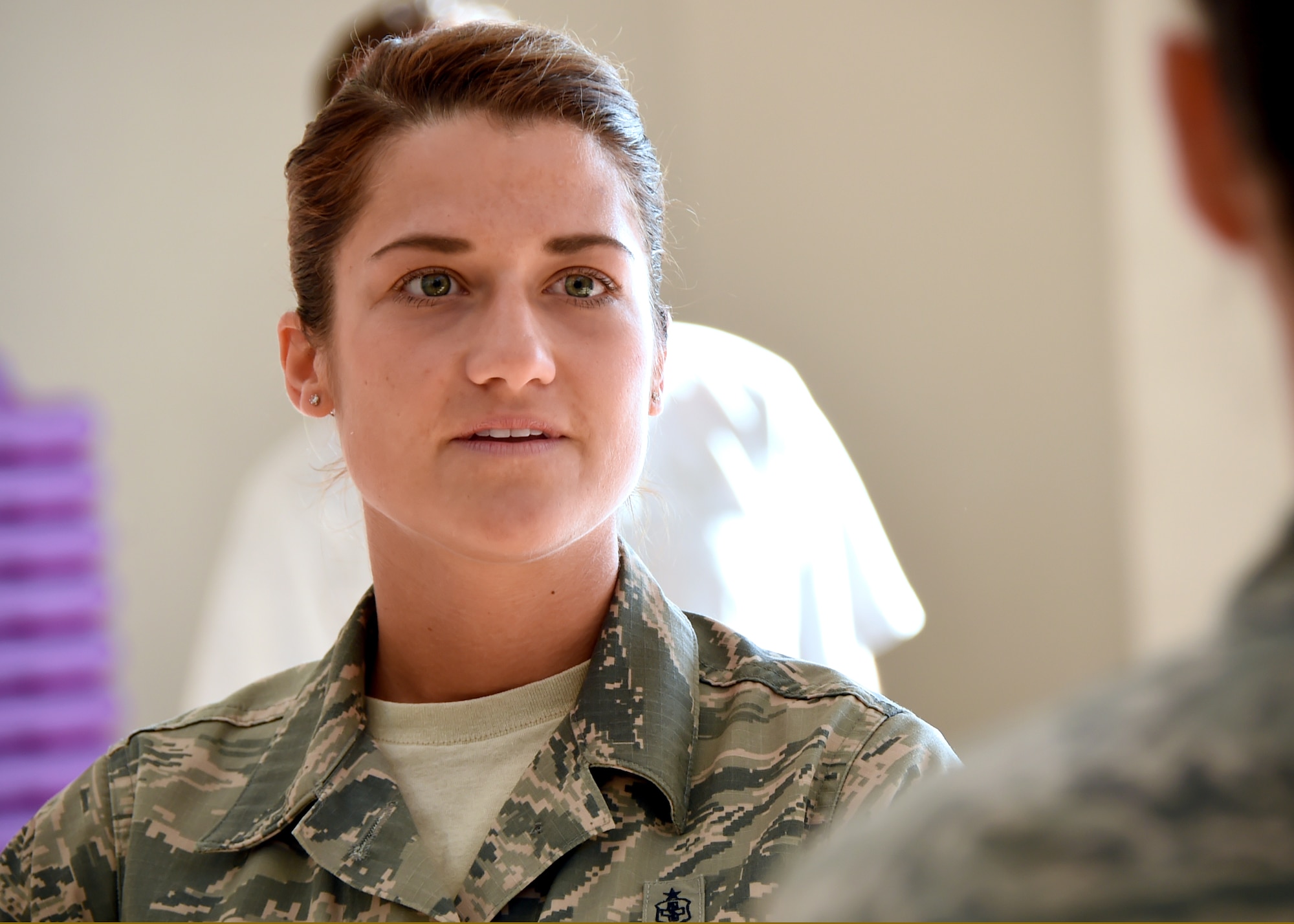 An initial look of surprise turns to relief and pure joy as Staff Sgt. Katelin Robinson is notified of her selection for Officer Training School through the Senior Leader Enlisted Commissioning Program. Robinson is the 61st Medical Squadron's noncommissioned officer in charge of Dental Logistics at the Los Angeles Air Force Base medical clinic in El Segundo, Calif.,(U.S. Air Force photo/Sarah Corrice)