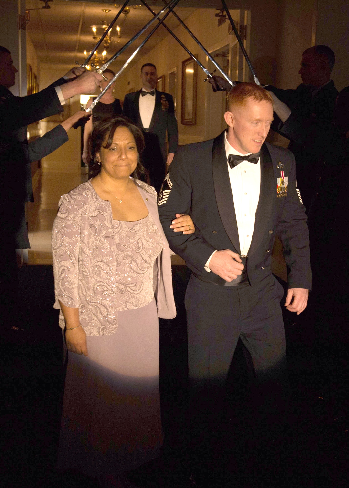Senior Master Sgt. Wesley J. Keville and his wife, Maria, are introduced during the Chief Master Sergeant Induction Banquet April 9. Keville, superintendent of Joint Surveillance Target Attack Radar System (JSTARS) Recapitalization Division, and Senior Master Sgt. Aaron Marley, superintendent of AFLCMC Detachment 7, were among 525 senior master sergeants the Air Force selected late last year for promotion to chief master sergeant. (U.S. Air Force photo by Jerry Saslav)