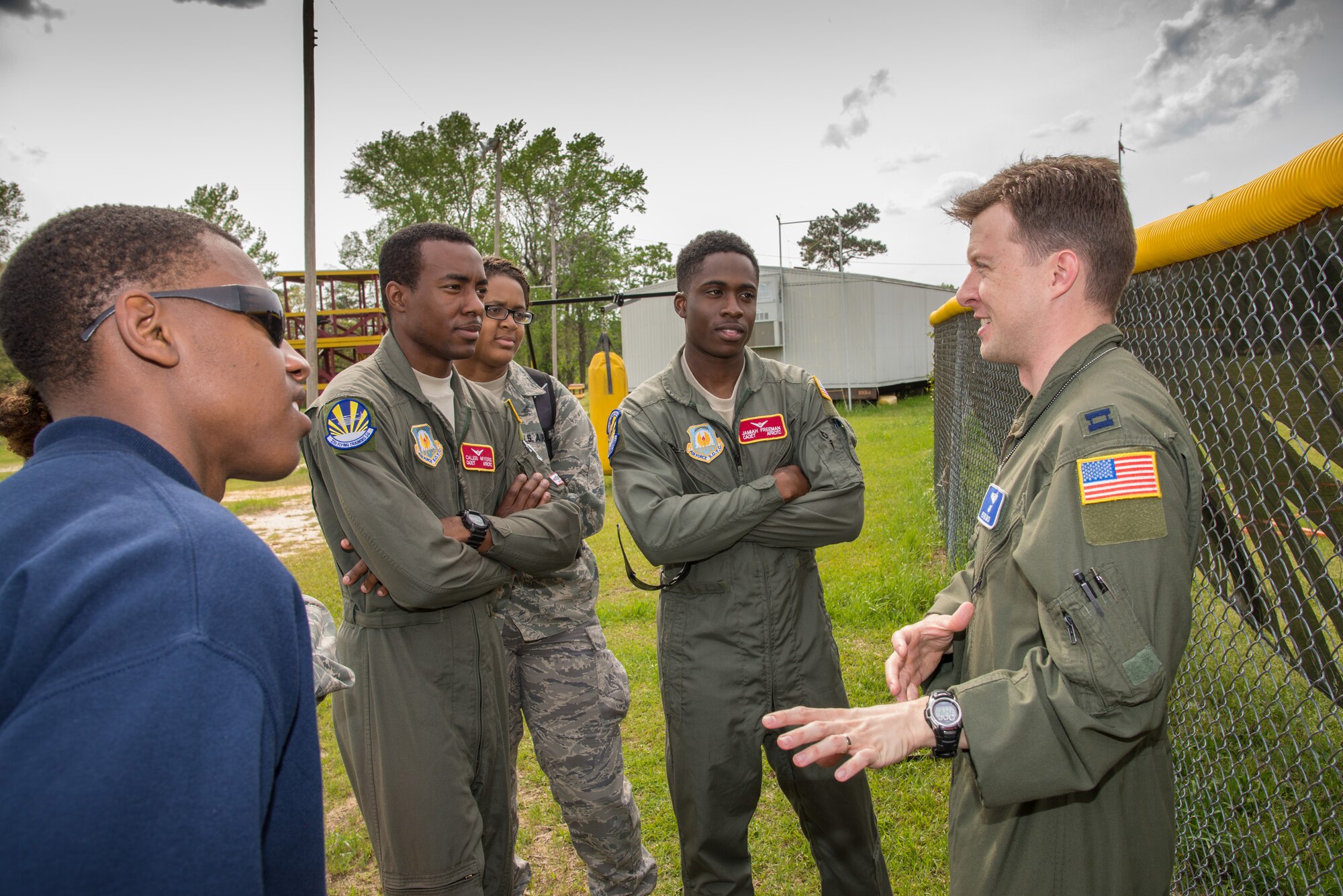 From left, Cadets Caleb Myers, Nemia Noble, and Jamiah Freeman, AFROTC students at Tuskegee University, discuss undergraduate pilot training and career broadening opportunities for pilots with Capt. Kevin Mack, far right, from the 23rd Flying Training Squadron at Fort Rucker, Alabama. Two helicopters from the 23rd FTS flew to Tuskegee University in Tuskegee, Alabama, on April 6 to give orientation flights on TH-UH1 Hueys(Photo by Stanley Ward III)
