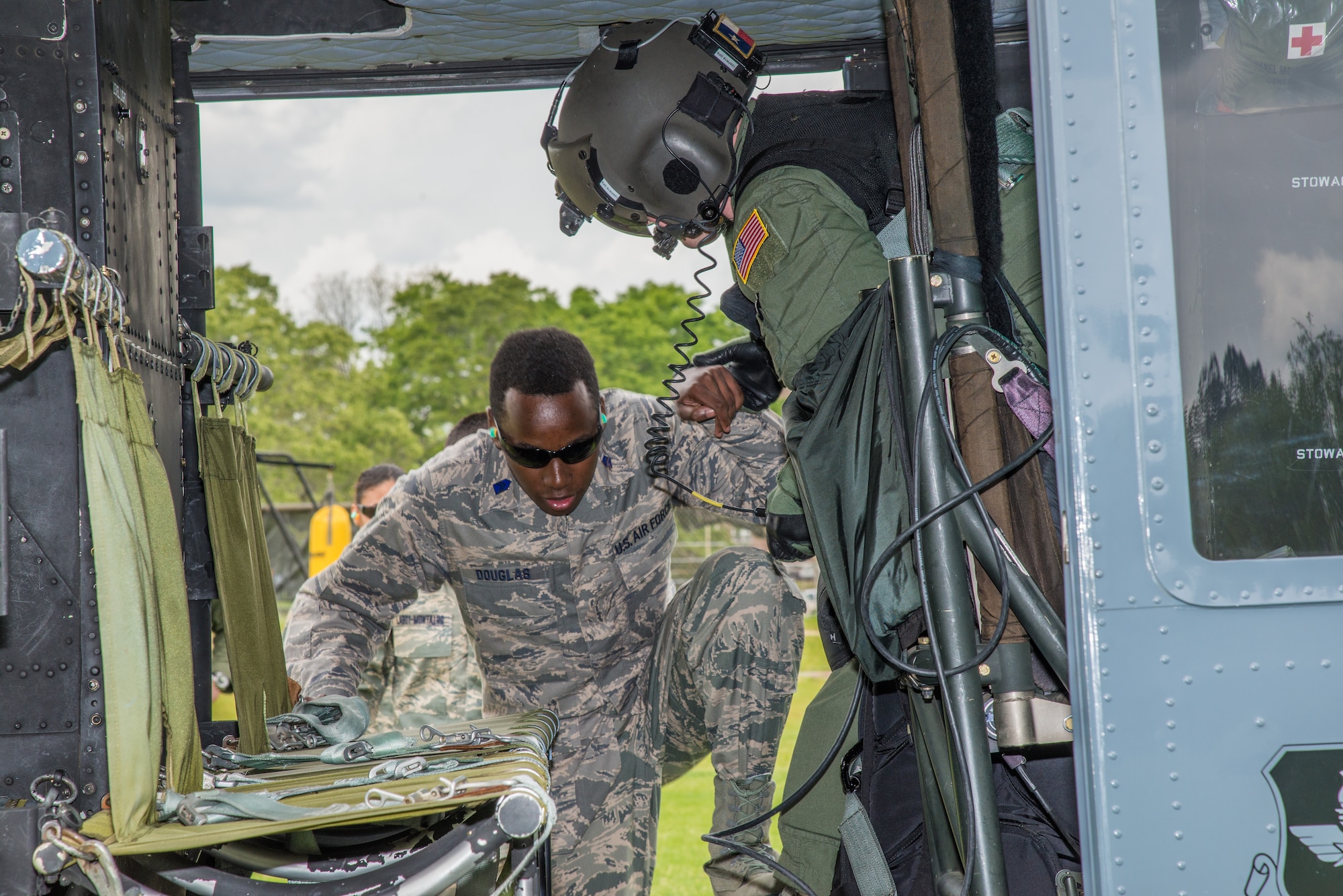 Cadet Torey Douglas, an AFROTC student at Tuskegee University boards a UH-TH1 Huey. Two helicopters from the 23rd Flying Training Squadron at Fort Rucker, Alabama, flew to Tuskegee University in Tuskegee, Alabama, on April 6 to give orientation flights on TH-UH1 Hueys. (Photo by Stanley Ward III)
