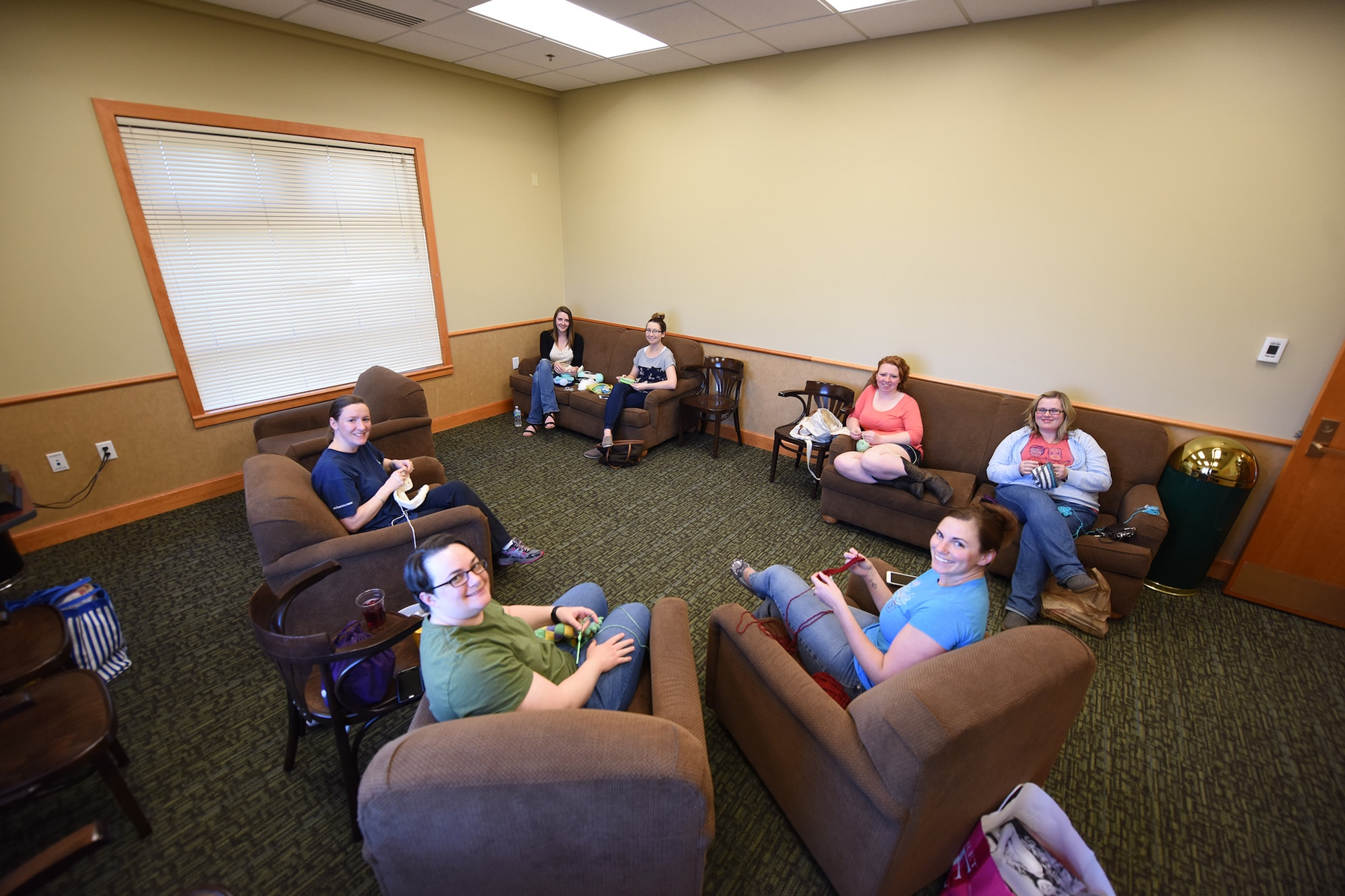 Members of the base Crochet Club pose for a group photo April 7, 2016, in the Grizzly Bend conference room at Malmstrom Air Force Base, Mont. The crochet club is open to all and items crocheted will be donated to cancer patients, rescue missions and children in foster care. (U.S. Air Force photo/Airman Colin Schmidt)

	

