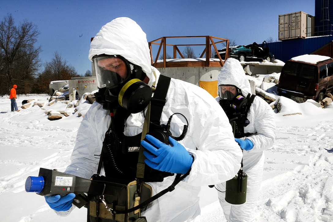Soldiers take radiation readings around a simulated radiological dispersal device blast during Exercise Arctic Eagle 2016 at Camp Grayling, Mich., April 5, 2016. The soldiers are assigned to the Indiana Air National Guard’s 53rd Weapons of Mass Destruction Civil Support Team. Air Force photo by Master Sgt. David Kujawa