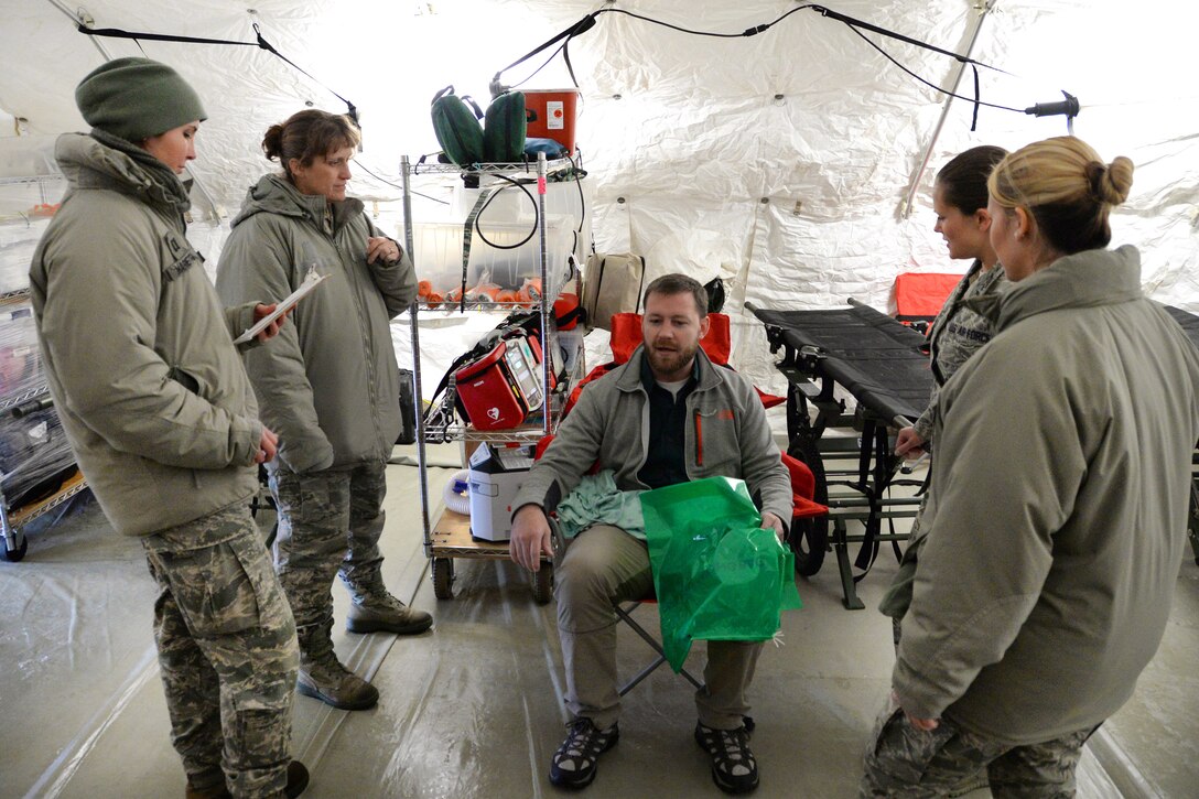 Airmen treat a simulated chemical explosion patient at the Munson Healthcare Grayling Hospital in Grayling, Mich., April 6, 2016. The airmen are assigned to the Indiana Air National Guard’s 19th CBRNE Enhanced Response Force Package, 181st Intelligence Wing. Indiana Air National Guard photo by Airman 1st Class Kevin D. Schulze