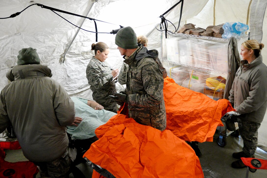 Airmen treat simulated chemical explosion patients at the Munson Healthcare Grayling Hospital in Grayling, Mich., April 6, 2016. Indiana Air National Guard photo by Airman 1st Class Kevin D. Schulze