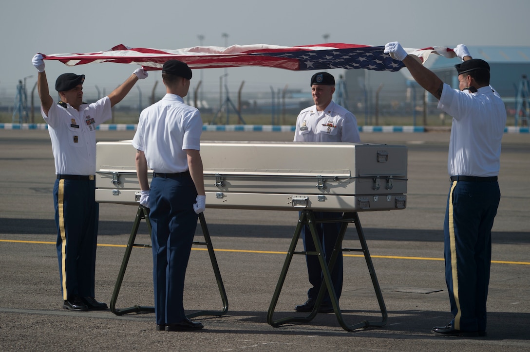 U.S. service members assigned to the Defense POW/MIA Accounting Agency conduct a repatriation ceremony in New Delhi, April 13, 2016, to mark the return of possible remains of U.S. service members lost in World War II. Defense Secretary Ash Carter attended the ceremony during his visit to India. DoD photo by Air Force Senior Master Sgt. Adrian Cadiz