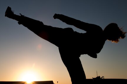 California Army National Guard Sgt. Cassandra Peel, an avionic mechanic in Company B, 640th Aviation Support Battalion, 40th Combat Aviation Brigade, practices taekwondo kicks at Camp Buehring, Kuwait, April 2, 2016. Peel has practiced taekwondo for six years and is now a second degree black belt. 