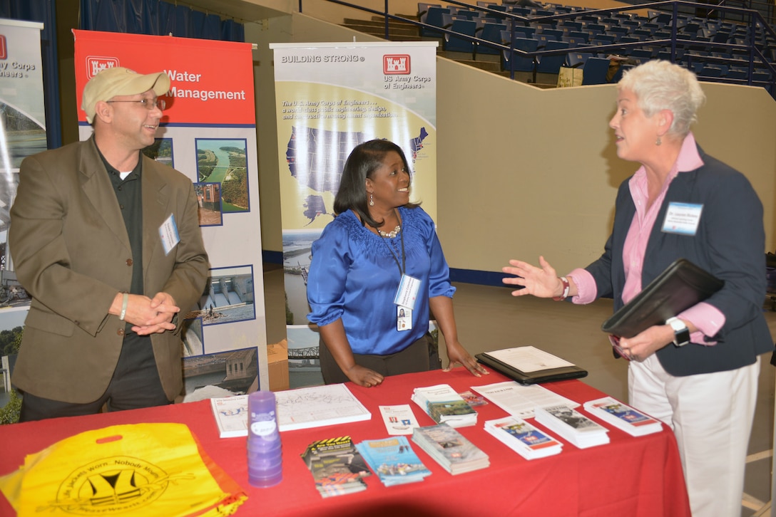David Claussen and Stephanie Coleman, both Equal Employment Office specialists with the U.S. Army Corps of Engineers talk with Dr. Lauren Ricky from the Johnson Learning Center Metro Nashville Public Scholls at a Science, Technology, Engineering and Mathematics Science Expo April 7, 2016 sponsored by the Middle Tennessee STEM Innovation Hub on the Tennessee State University campus at the Gentry Center. The group staffed the exhibit and talked with students about Corps STEM subjects.   