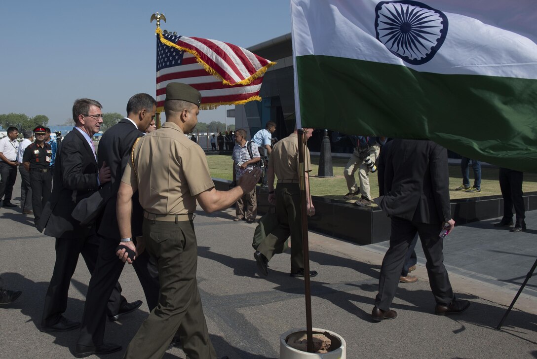 Defense Secretary Ash Carter, foreground left, departs from a repatriation ceremony in New Delhi, April 13, 2016. DoD photo by Air Force Senior Master Sgt. Adrian Cadiz
