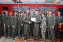 Capt. Paul Homsher, center, 85th Flying Training Squadron c-flight assistant flight commander and T-6 Texan II instructor pilot, accepts the “XLer of the Week” award from Col. Thomas Shank, left, 47th Flying Training Wing commander, and Chief Master Sgt. Teresa Clapper, right, 47th FTW command chief, here, April 6, 2016. The XLer is a weekly award chosen by wing leadership and is presented to those who consistently make outstanding contributions to their unit and Laughlin. (U.S. Air Force photo by Senior Airman Jimmie D. Pike)